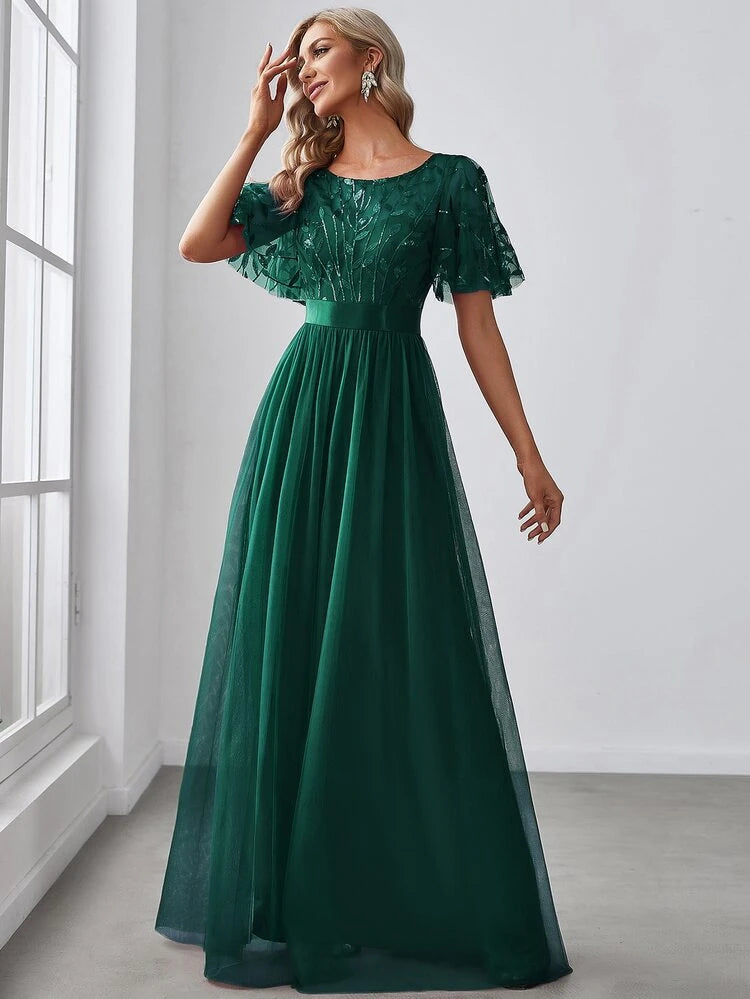 Vestido verde esmeralda aplicación lentejuelas y falda tul