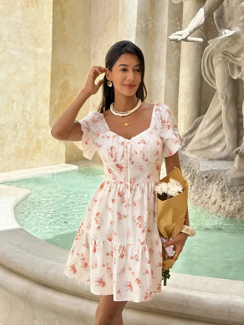 Vestido corto blanco con flores naranjas pequeñas
