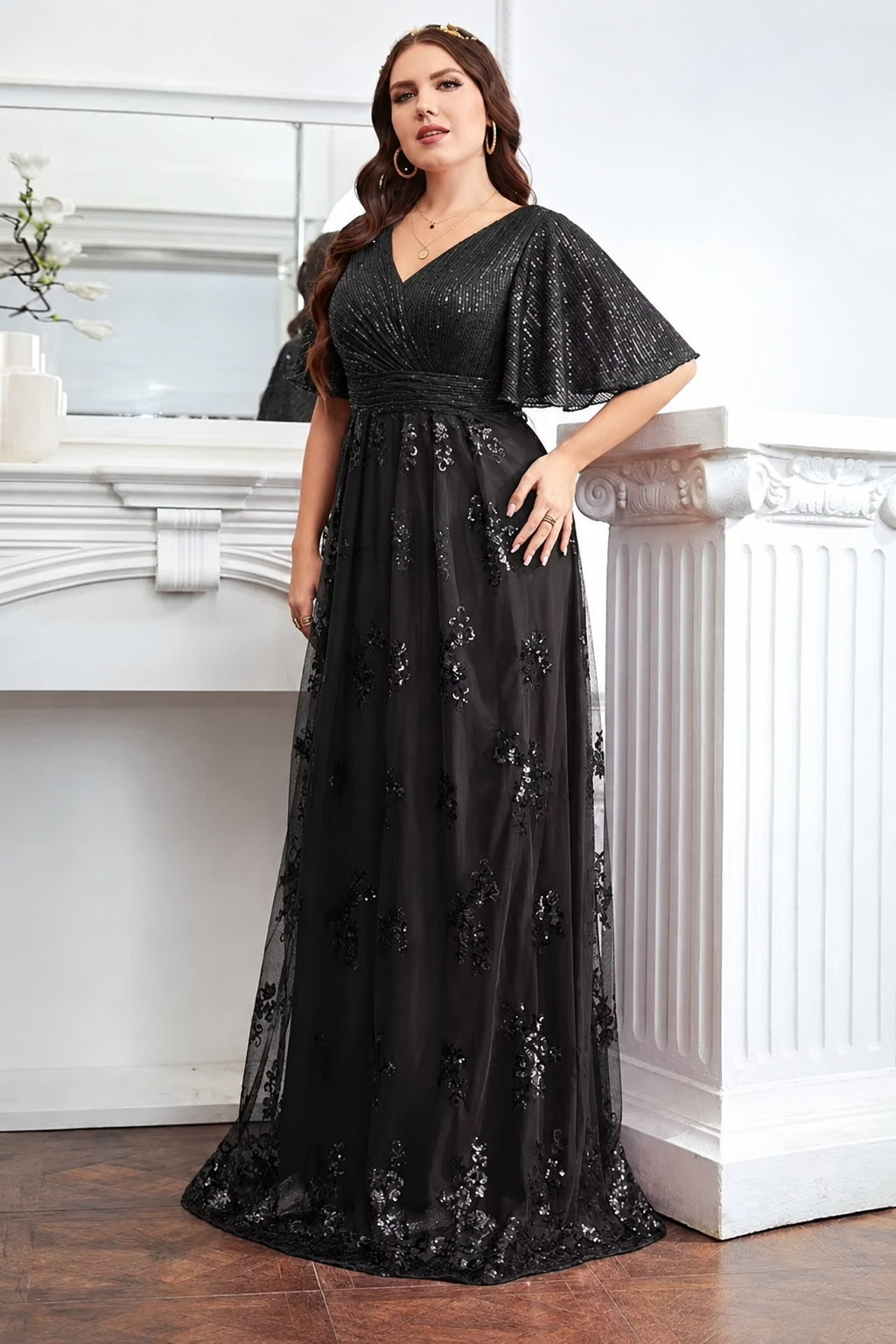 Vestido negro lentejuelas manga mariposa con falda aplicación floral corte A
