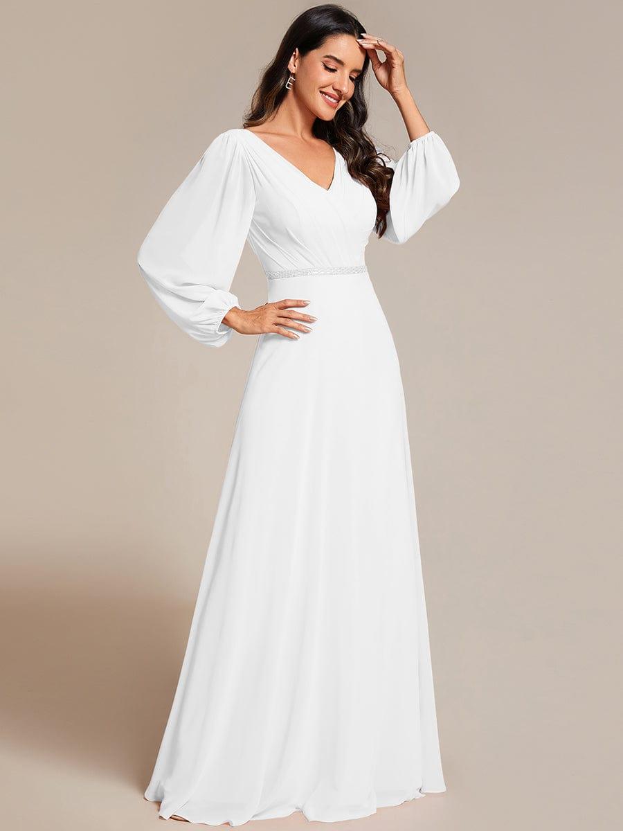 Vestido blanco manga larga corte A con aplicación plateada